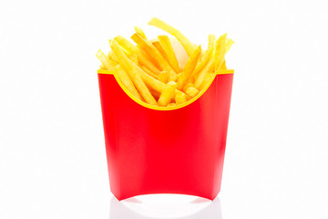 French fries potatoes in red fry box isolated on white background with reflection