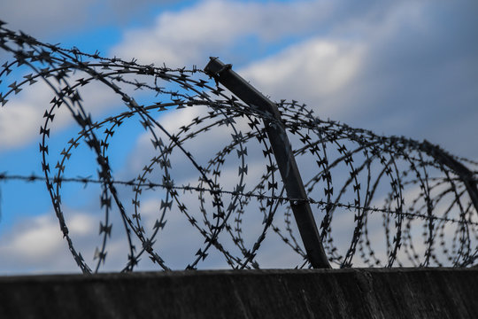 Barbed wire on a prison wall