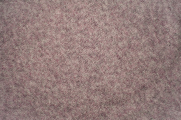 Texture of pink woven wool knitted sweater. Fabric background