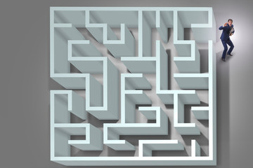 Businessman is trying to escape from maze labyrinth