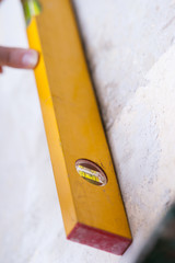 Worker using spirit level tool 