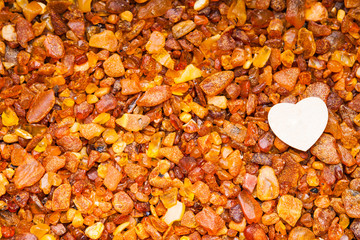 Amber stones and white heart shape