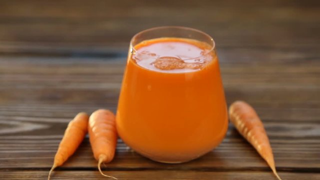 Carrot juice in glass on  table