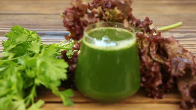 parsley and celery juice in glass on  table