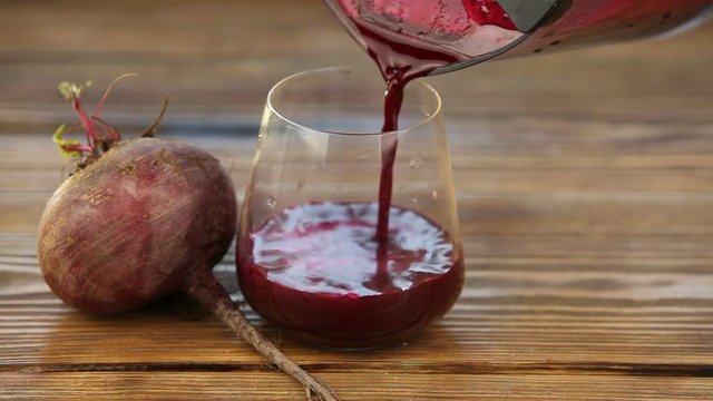 beet juice in glass on  table