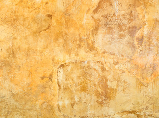 Close up grungy orange cement wall texture background