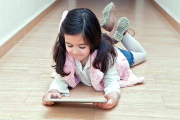 girl in the hallway handles a tablet