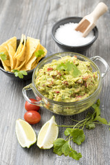 Bowl of guacamole with tortilla chips