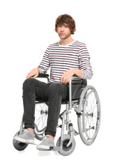 Young man in wheelchair on white background