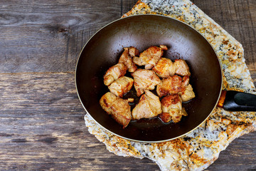 Stewed meat in a fryer wok cooked food ready for eat