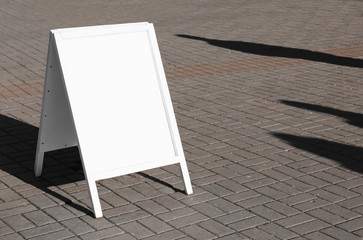 Blank advertising board on city street