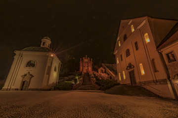 Monastery in night town Ostrov near Karlovy Vary city