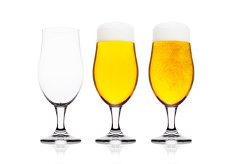 Cold glasses of lager ale beer with foam
