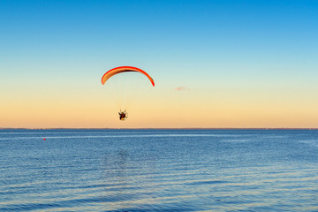 Flying paraglider over the Baltic sea. Rewa, Poland.