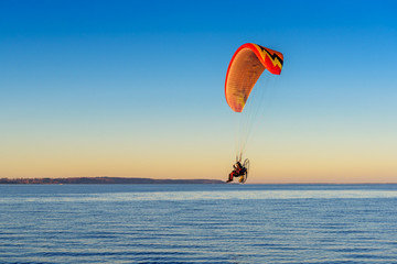 Flying paraglider over the Baltic sea. Rewa, Poland.