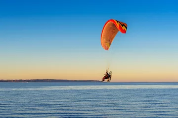 Fototapeten Flying paraglider over the Baltic sea. Rewa, Poland. © vivoo