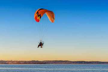 Flying paraglider over the Baltic sea. Rewa, Poland.