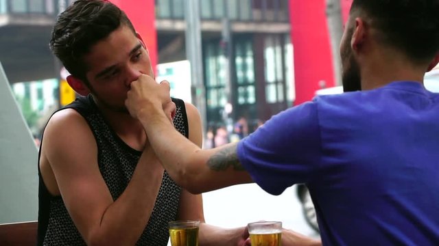 Homosexual Couple Drinking Beer in a Pub in Paulista Avenue, Sao Paulo, Brazil