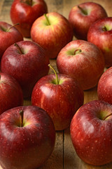 Fototapeta na wymiar pile of red apples on wooden table