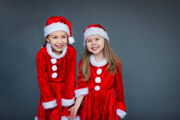 two girls Santa helpers having fun