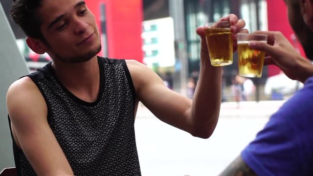 Homosexual Couple Drinking Beer in a Pub in Paulista Avenue, Sao Paulo, Brazil