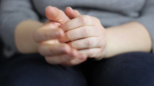 Close-up women's hands scratch