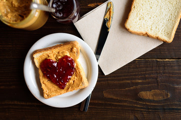 Peanut butter and heart shaped jelly sandwich