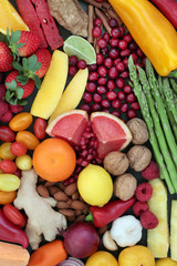 Healthy diet food with fruit and vegetable selection. Superfood concept high in antioxidants, anthocyanins, vitamins fibre and minerals, top view.
