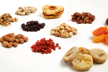 piles of Mixed dried fruits and nuts - symbols of jewish holiday Tu Bishvat