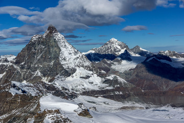 Fototapeta premium Winter panorama of mount Matterhorn covered with clouds, Canton of Valais, Alps, Switzerland 