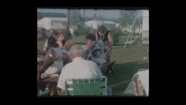 1961 Suburban family backyard barbecue