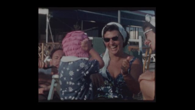 1962 Woman puts Pink bathing cap on humiliated 3 year old little boy