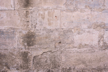 Brick wall with the remains of white paint - beautiful vintage grunge background