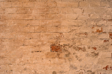 Ancient collapsing brick wall, vintage grunge background, texture