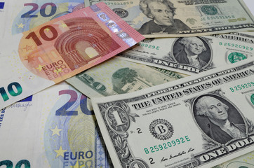 Fototapeta na wymiar Euro banknotes and american dollars are laid out