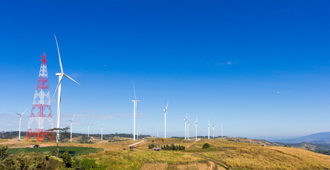 Wind turbines on hill top.