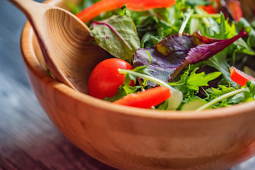 Fresh rustic vegetable salad on rustic background