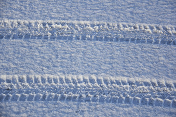 car tire drops in the snow