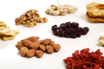 piles of Mixed dried fruits and nuts - symbols of jewish holiday Tu Bishvat
