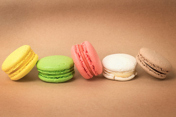 Colored macaroons on craft cardboard