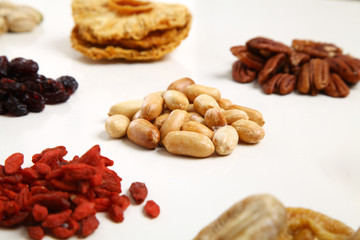 piles of Mixed dried fruits and nuts - symbols of jewish holiday Tu Bishvat