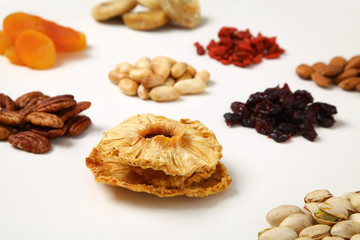 piles of Mixed dried fruits and nuts - symbols of jewish holiday Tu Bishvat