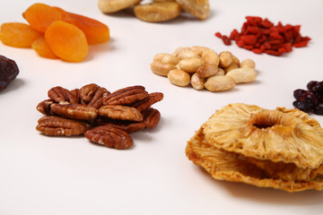 piles of Mixed dried fruits and nuts - symbols of jewish holiday Tu Bishvat