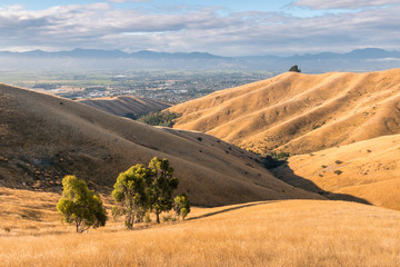 Fototapeta na wymiar sunset over Wither Hills with Blenheim town in background, New Zealand