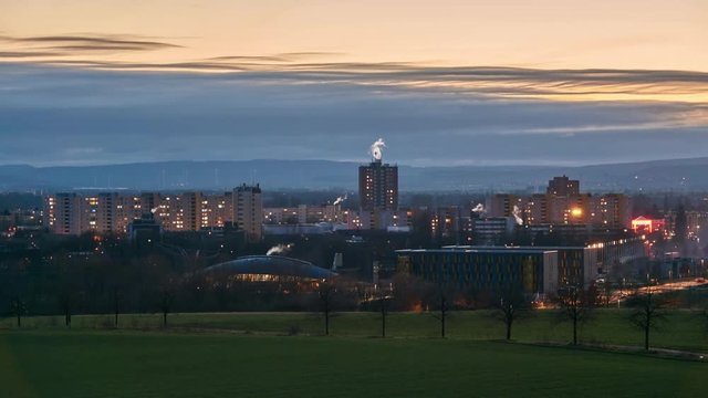 Silhouette of the city of Laatzen in the January evening. 4K. Time lapse.