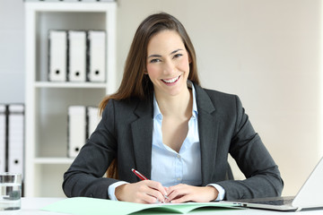 Office worker posing looking at camera