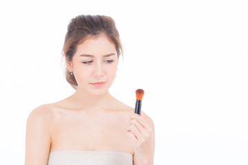 Beauty asian woman applying make up with brush of cheek isolated on white background, beautiful of girl holding blusher, skincare and cosmetic concept.