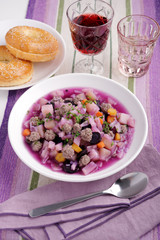 Purple carrot soup with meatballs