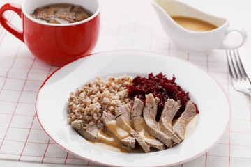 Boiled meat with buckwheat porridge