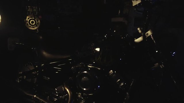 Darkness illuminates flame motorcycle with airbrushing